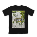 Black t-shirt with a graphic of a coffee shop exterior on a white background